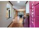 Inviting foyer with a view into a dining room with built-in shelving at 4215 Water Oaks Ln, Tampa, FL 33618