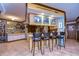 Eat-in kitchen features counter seating, natural light, and easy access to adjacent rooms at 4215 Water Oaks Ln, Tampa, FL 33618