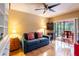 Cozy living room with hardwood floors and sliding glass doors leading to the screened lanai at 4215 Water Oaks Ln, Tampa, FL 33618