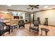 Inviting living area with tiled floors, comfortable seating, and easy access to kitchen counter seating at 4215 Water Oaks Ln, Tampa, FL 33618