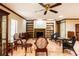 Inviting living room featuring a cozy fireplace and custom built-in shelving at 4215 Water Oaks Ln, Tampa, FL 33618