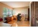 Office features hardwood floors, natural light from the window, and wood cabinets at 4215 Water Oaks Ln, Tampa, FL 33618
