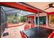 Expansive screened patio with multiple seating areas and lush landscaping at 4215 Water Oaks Ln, Tampa, FL 33618