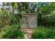 Charming backyard shed surrounded by lush greenery, providing ample storage and a touch of rustic charm at 4215 Water Oaks Ln, Tampa, FL 33618