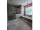 Bathroom featuring glass-enclosed shower and luxurious bathtub, perfect for relaxation and comfort at 4323 Baynes Rd, North Port, FL 34288