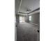 Large bedroom with a sliding glass door to outdoor area, and tray ceiling at 4323 Baynes Rd, North Port, FL 34288