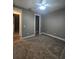 Bedroom with ceiling fan and walk-in closet entrance for added storage at 4323 Baynes Rd, North Port, FL 34288