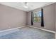 Cozy bedroom with a ceiling fan and a window offering natural light at 4323 Baynes Rd, North Port, FL 34288