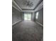 Spacious bedroom with tray ceiling, sliding glass doors and outdoor view at 4323 Baynes Rd, North Port, FL 34288