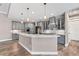 Modern kitchen features gray cabinets, granite countertops, and stainless steel appliances at 4323 Baynes Rd, North Port, FL 34288
