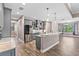 Open kitchen features gray cabinets, granite countertops, and stainless steel appliances at 4323 Baynes Rd, North Port, FL 34288