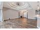 Expansive living room with high ceilings, tile flooring, and a seamless flow to the kitchen at 4323 Baynes Rd, North Port, FL 34288
