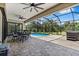 Relaxing screened-in patio with outdoor dining and beautiful pool view at 4323 Baynes Rd, North Port, FL 34288