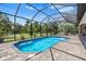 A refreshing swimming pool with a screened enclosure, perfect for relaxation at 4323 Baynes Rd, North Port, FL 34288