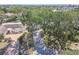 An aerial view of a home highlighting its lush surroundings and curb appeal from an elevated perspective at 4368 Marine Pkwy, New Port Richey, FL 34652