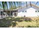 Enjoy a serene backyard with mature trees and a screened-in porch at 4368 Marine Pkwy, New Port Richey, FL 34652