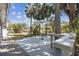 Outdoor deck featuring an umbrella table, bench seating and gorgeous water views at 4368 Marine Pkwy, New Port Richey, FL 34652