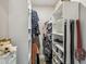 Walk-in closet featuring custom shelving, ample storage for clothes, shoes and personal items at 4368 Marine Pkwy, New Port Richey, FL 34652