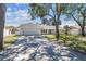 Well-maintained single Gathering home with an attached two-car garage and a long driveway at 4368 Marine Pkwy, New Port Richey, FL 34652