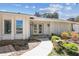 Beautiful home featuring a meticulously maintained front yard and decorative landscaping elements at 4368 Marine Pkwy, New Port Richey, FL 34652
