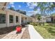Charming home featuring a well-manicured lawn, flower beds, and a welcoming walkway leading to the entrance at 4368 Marine Pkwy, New Port Richey, FL 34652