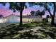 Charming home with a manicured lawn, mature trees and lovely landscaping at 4368 Marine Pkwy, New Port Richey, FL 34652