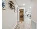 Hallway boasts wood-look flooring and open floor plan with easy access to the living room and kitchen at 4368 Marine Pkwy, New Port Richey, FL 34652
