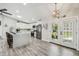 Modern kitchen featuring white cabinets, stainless steel appliances, and a center island at 4368 Marine Pkwy, New Port Richey, FL 34652