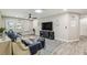 Cozy living room with comfortable seating, wood flooring, and nautical decor creating a relaxing atmosphere at 4368 Marine Pkwy, New Port Richey, FL 34652