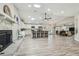 Open-concept kitchen and living area featuring wood floors, ample natural light, and seamless flow for modern living at 4368 Marine Pkwy, New Port Richey, FL 34652