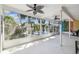 Spacious screened lanai overlooking lush landscaping, offering a tranquil outdoor living space at 4368 Marine Pkwy, New Port Richey, FL 34652