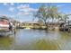 Picturesque waterfront featuring private boat docks and lush tropical landscaping at 4368 Marine Pkwy, New Port Richey, FL 34652