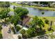 Home with mature trees, large driveway, and lake view at 4520 Wescott Ln, Tampa, FL 33624