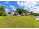 Expansive backyard leading to a serene lake at 4520 Wescott Ln, Tampa, FL 33624