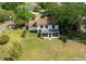 Aerial view of the home's spacious backyard with a screened-in porch and well-maintained lawn at 4520 Wescott Ln, Tampa, FL 33624