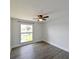 Bright bedroom featuring neutral walls, a ceiling fan, and a view of the water at 4520 Wescott Ln, Tampa, FL 33624