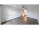 Spacious bedroom with wood-look flooring and ensuite bathroom at 4520 Wescott Ln, Tampa, FL 33624