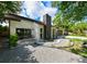 Single-story home with a manicured front lawn, lovely landscaping, and a two-car garage at 4520 Wescott Ln, Tampa, FL 33624