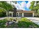 Charming single-story home with well-manicured front yard and appealing curb appeal at 4520 Wescott Ln, Tampa, FL 33624