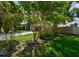 Lush front yard with mature trees frames a lovely single-Gathering home, enhancing its curb appeal and privacy at 4520 Wescott Ln, Tampa, FL 33624