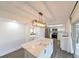 Modern kitchen with white cabinets, stainless steel appliances, and a white marble island at 4520 Wescott Ln, Tampa, FL 33624