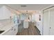 Bright and airy kitchen featuring white cabinetry, a kitchen island, and modern appliances at 4520 Wescott Ln, Tampa, FL 33624