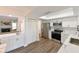 Well-lit kitchen with white cabinetry, stainless steel appliances, and ample counter space at 4520 Wescott Ln, Tampa, FL 33624