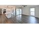 Open floor plan with a modern kitchen that opens to a combined dining/living area at 4520 Wescott Ln, Tampa, FL 33624