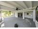 Spacious enclosed lanai featuring multiple ceiling fans at 4520 Wescott Ln, Tampa, FL 33624
