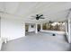 Enclosed lanai with ceiling fans and access to the yard at 4520 Wescott Ln, Tampa, FL 33624
