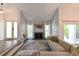 Bright living room with fireplace and large windows, creating an inviting and cozy atmosphere at 4520 Wescott Ln, Tampa, FL 33624