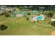 Aerial view of community park with tennis courts, basketball court and outdoor swimming pool at 4520 Wescott Ln, Tampa, FL 33624