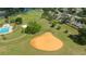 Aerial view of community park showing a baseball field, soccer fields and swimming pool at 4520 Wescott Ln, Tampa, FL 33624