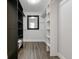 Well-organized walk-in closet with ample storage, shelving, and a full-length mirror at 4520 Wescott Ln, Tampa, FL 33624